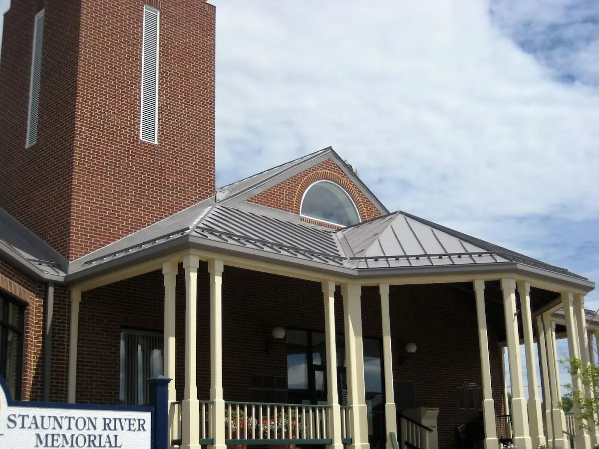 Skilled roofing craftsmen working on a residential roof in Dubuque